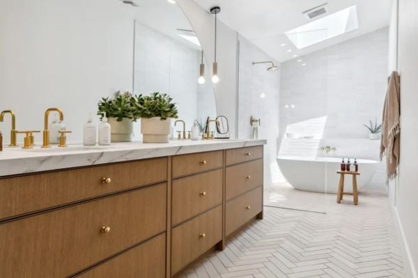 Trinity Homes bathroom remodel in Arizona with marble countertop, skylight, and walk-in shower